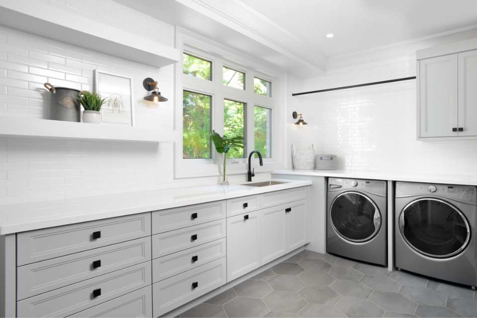 gray hexagon large format tile floor in laundry mudroom with farmhouse style